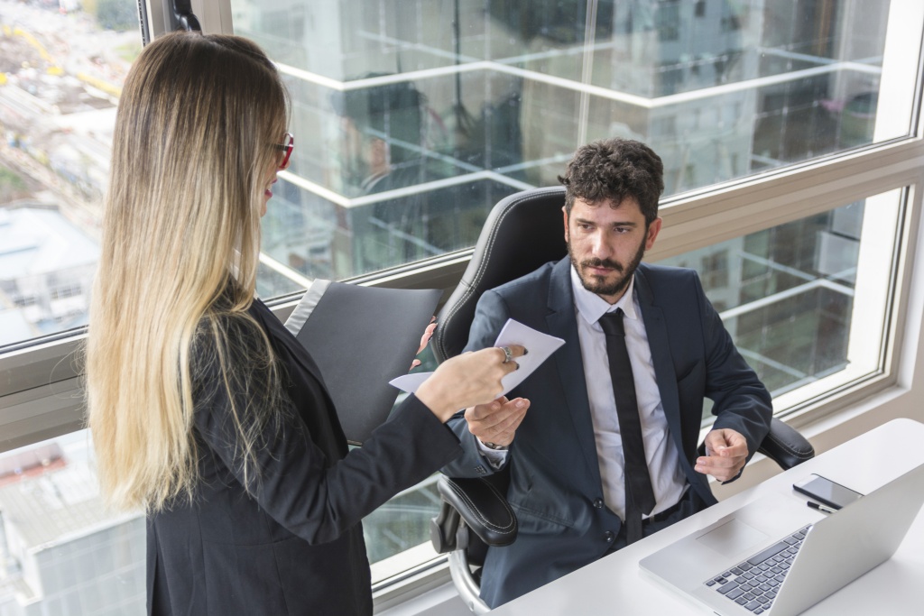 female-secretary-giving-document-male-manager-workplace.jpg офис
